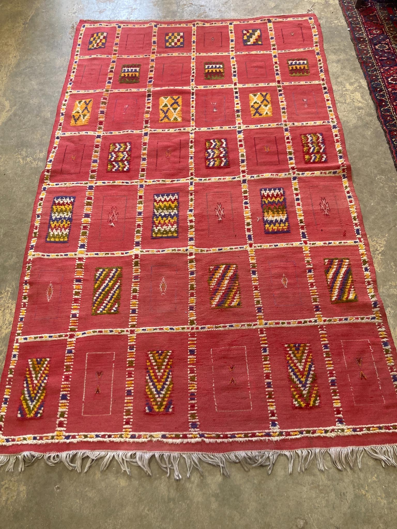 A Moroccan red ground rug